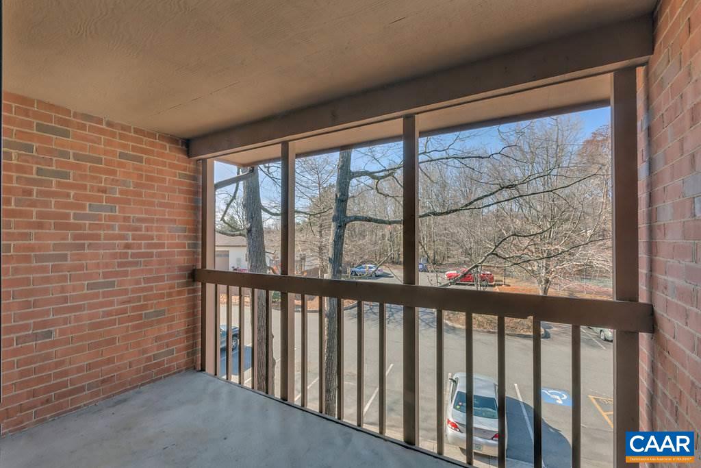 101 Turtle Creek Road, Unit 12 Charlottesville, VA 22901 - Photo 22 of 36 a view of a porch with wooden floor