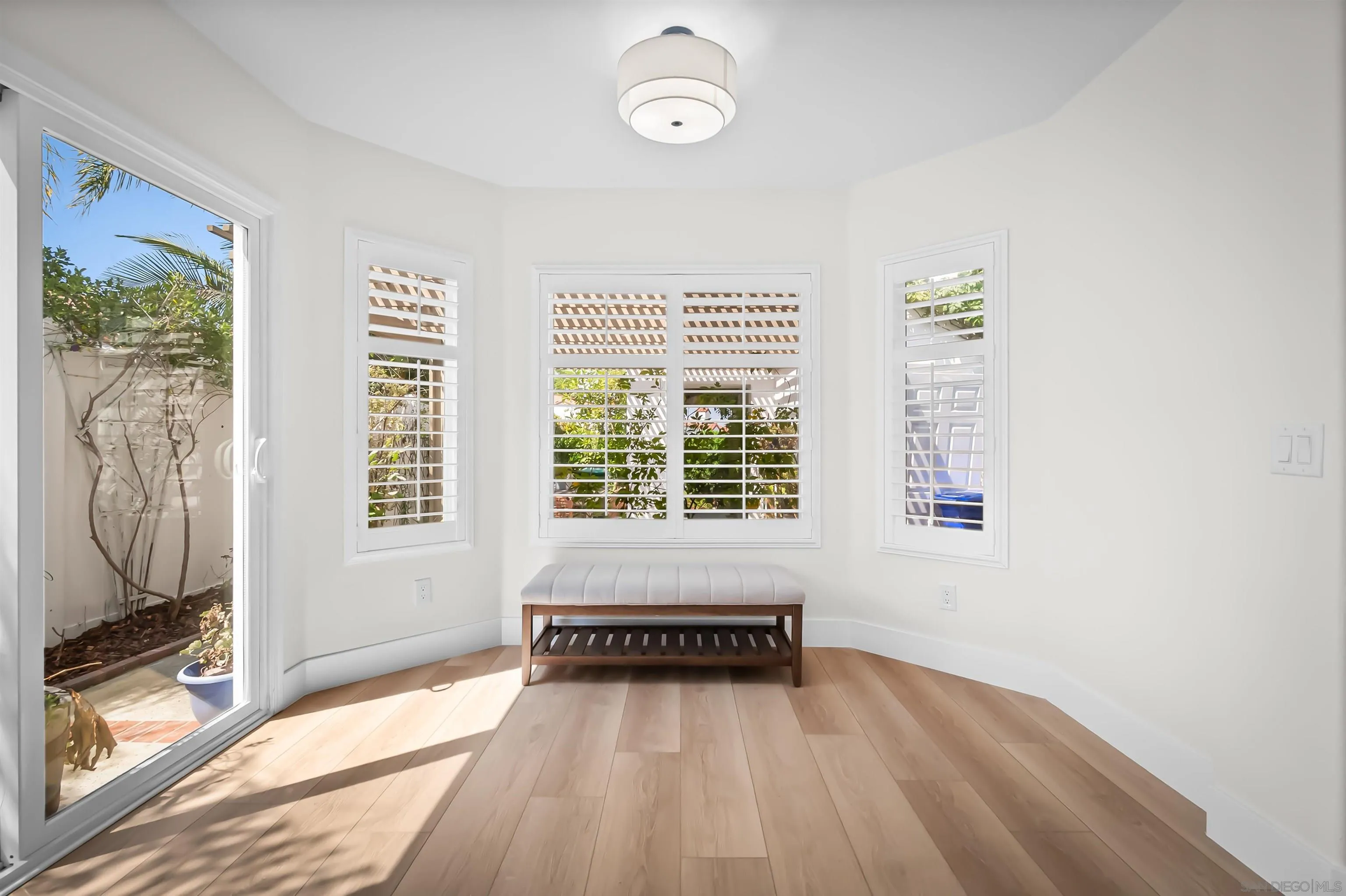 4058 Lemnos Way Oceanside, CA 92056 - Photo 12 of 47 a view of a room with a window and wooden floor
