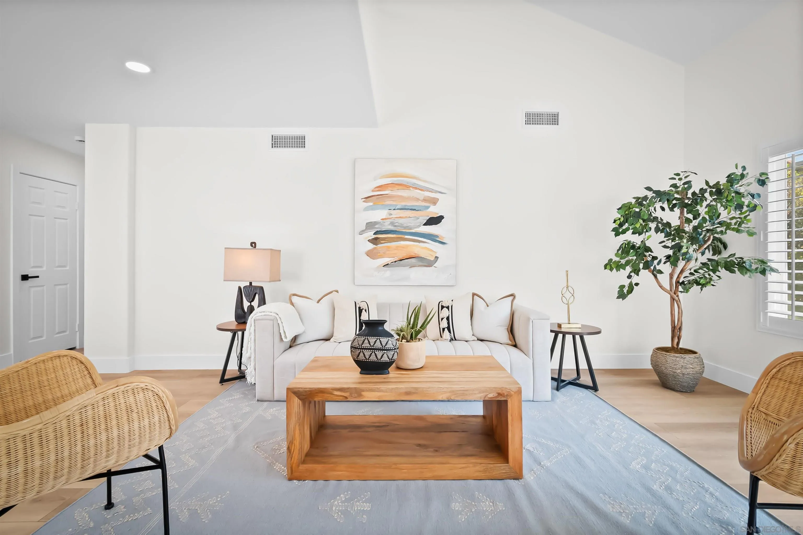 4058 Lemnos Way Oceanside, CA 92056 - Photo 14 of 47 a living room with furniture and a potted plant