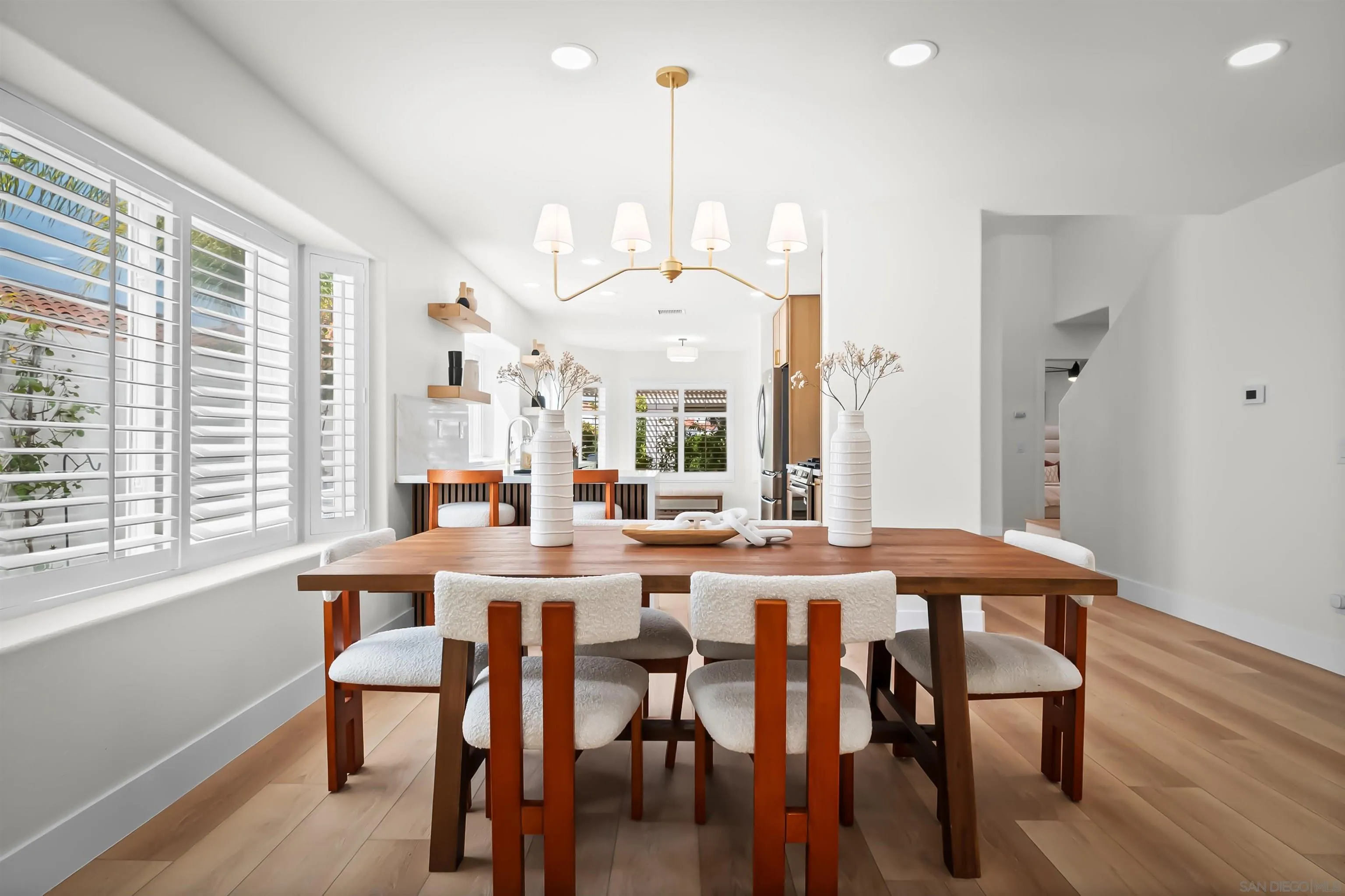 4058 Lemnos Way Oceanside, CA 92056 - Photo 2 of 47 a view of a dining room with furniture window and wooden floor