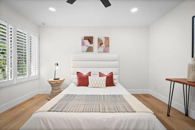 a bedroom with a bed and window