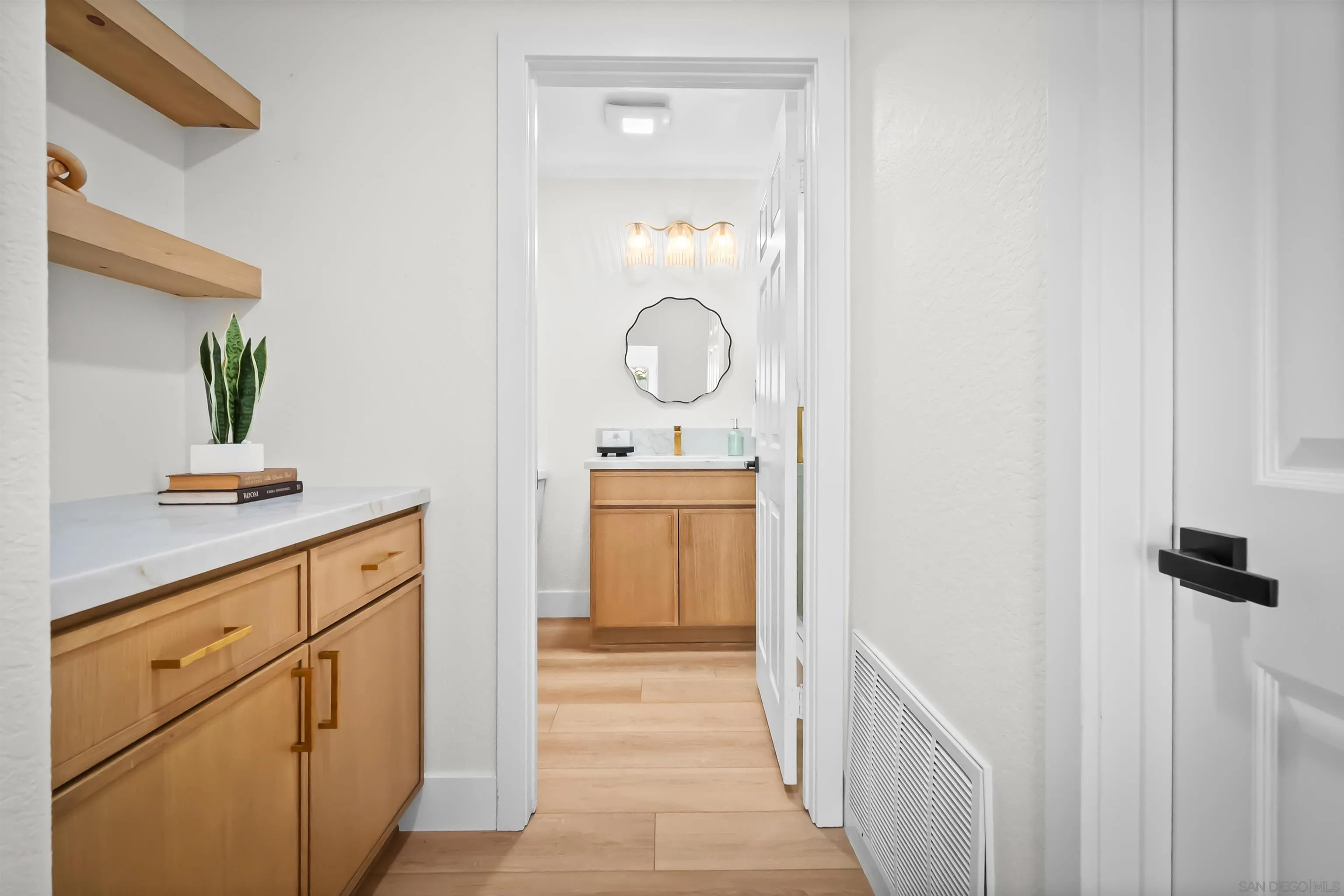 4058 Lemnos Way Oceanside, CA 92056 - Photo 32 of 47 a hallway with view of wooden floors