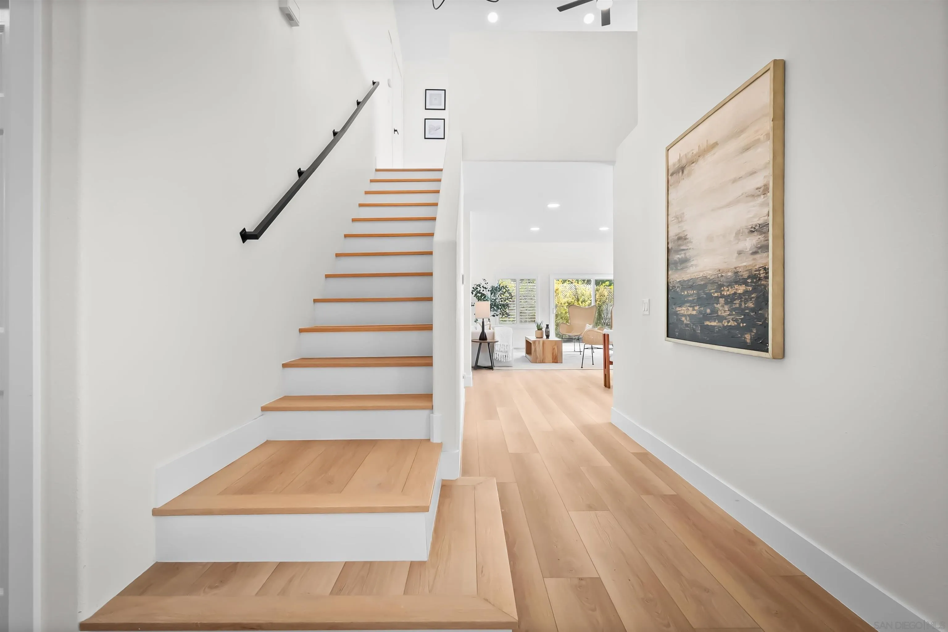 4058 Lemnos Way Oceanside, CA 92056 - Photo 33 of 47 a view of entryway and hall with wooden floor