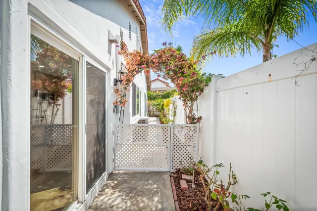 a view of a house with a tree in front