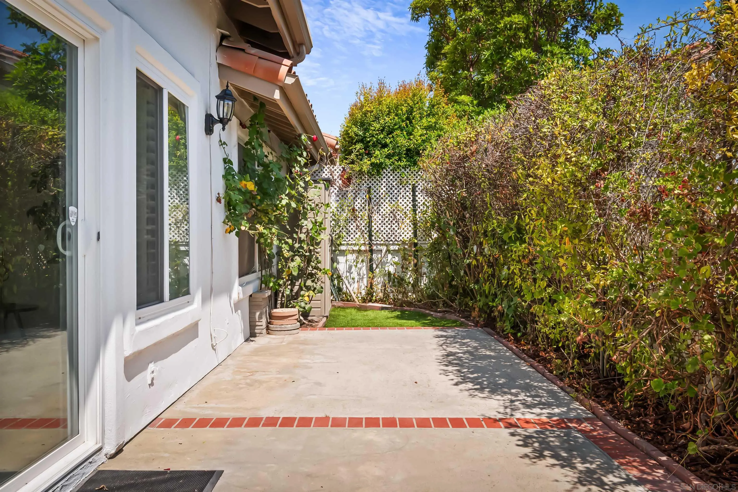 4058 Lemnos Way Oceanside, CA 92056 - Photo 42 of 47 a view of a pathway of a house with a patio