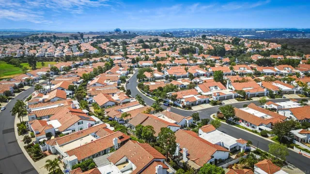 an aerial view of a city with lots of residential buildings