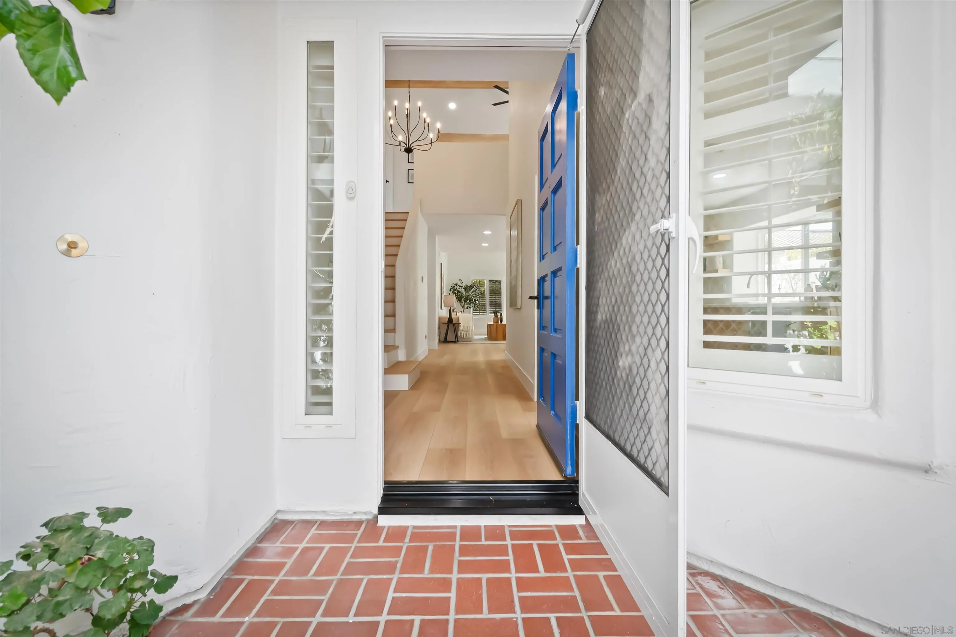 4058 Lemnos Way Oceanside, CA 92056 - Photo 10 of 47 a view of a hallway with wooden floor and a dining room