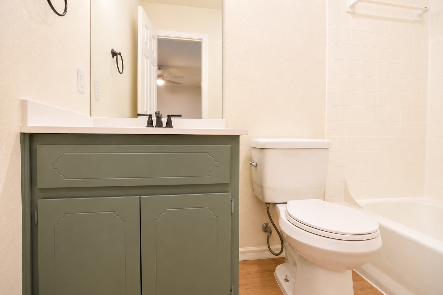 8807 Springmail Circle, Unit A Austin, TX 78729 - Photo 20 of 40 A well-maintained lavatory features a crisp white vanity and a practical bathtub.