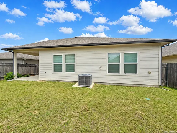 a house that has a big yard in front of it
