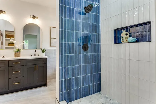 a kitchen with a dining table chairs and white cabinets