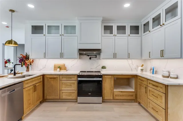 a bathroom with 2 sink and a mirror