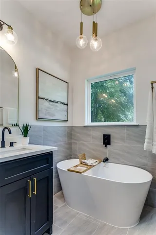 a kitchen with a table chairs stove and microwave