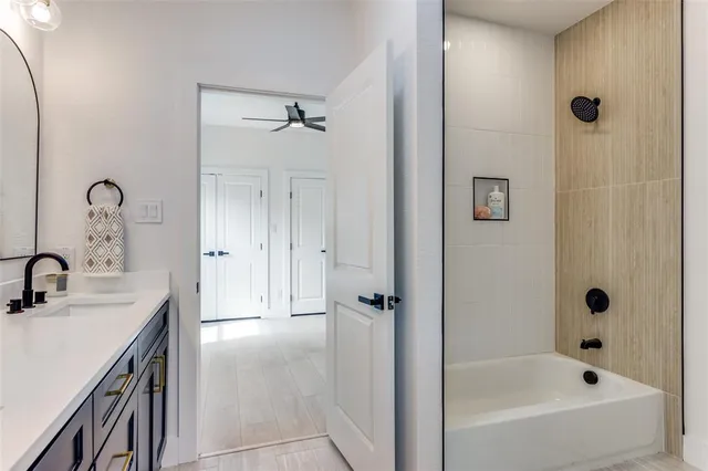 a spacious bathroom with a bathtub and sink