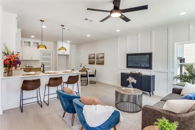 a bathroom with a tub shower vanity and a sink