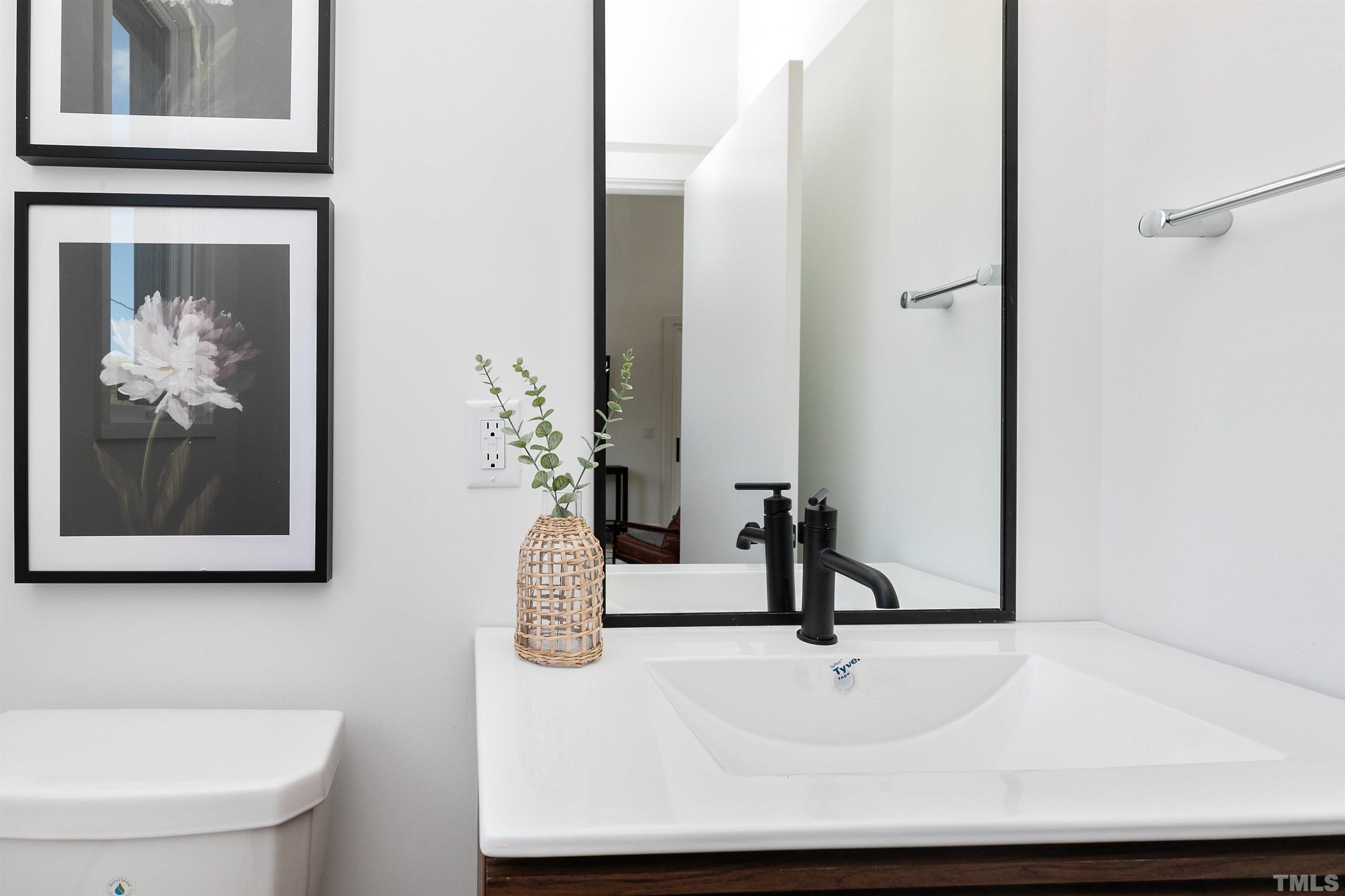 2159 Parker Street, Unit B Raleigh, NC 27607 - Photo 22 of 29 a bathroom with a sink and a mirror