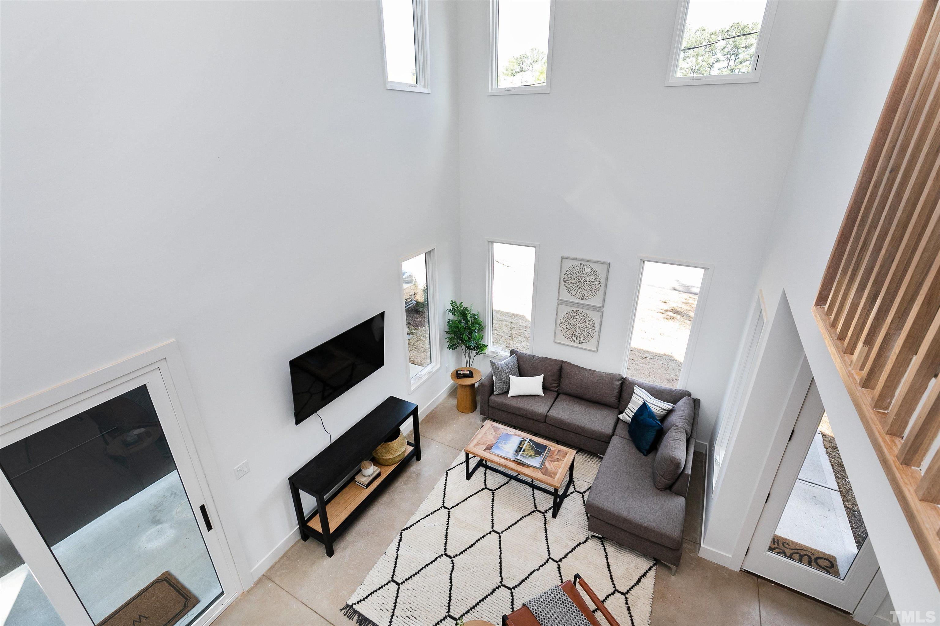 2159 Parker Street, Unit B Raleigh, NC 27607 - Photo 24 of 29 a living room with furniture and a flat screen tv