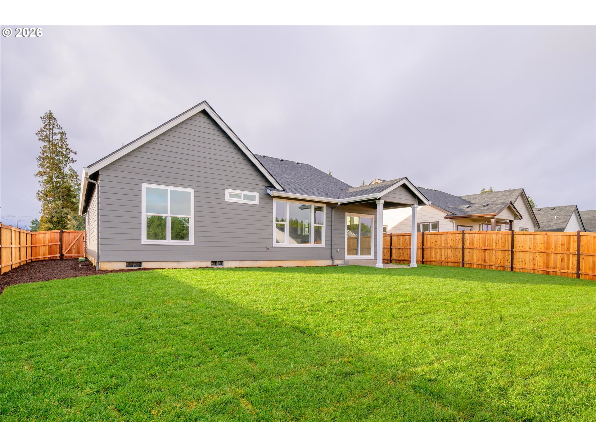 88091 Jameson Way Veneta, OR 97487 - Photo 20 of 22 a view of a house with backyard and garden