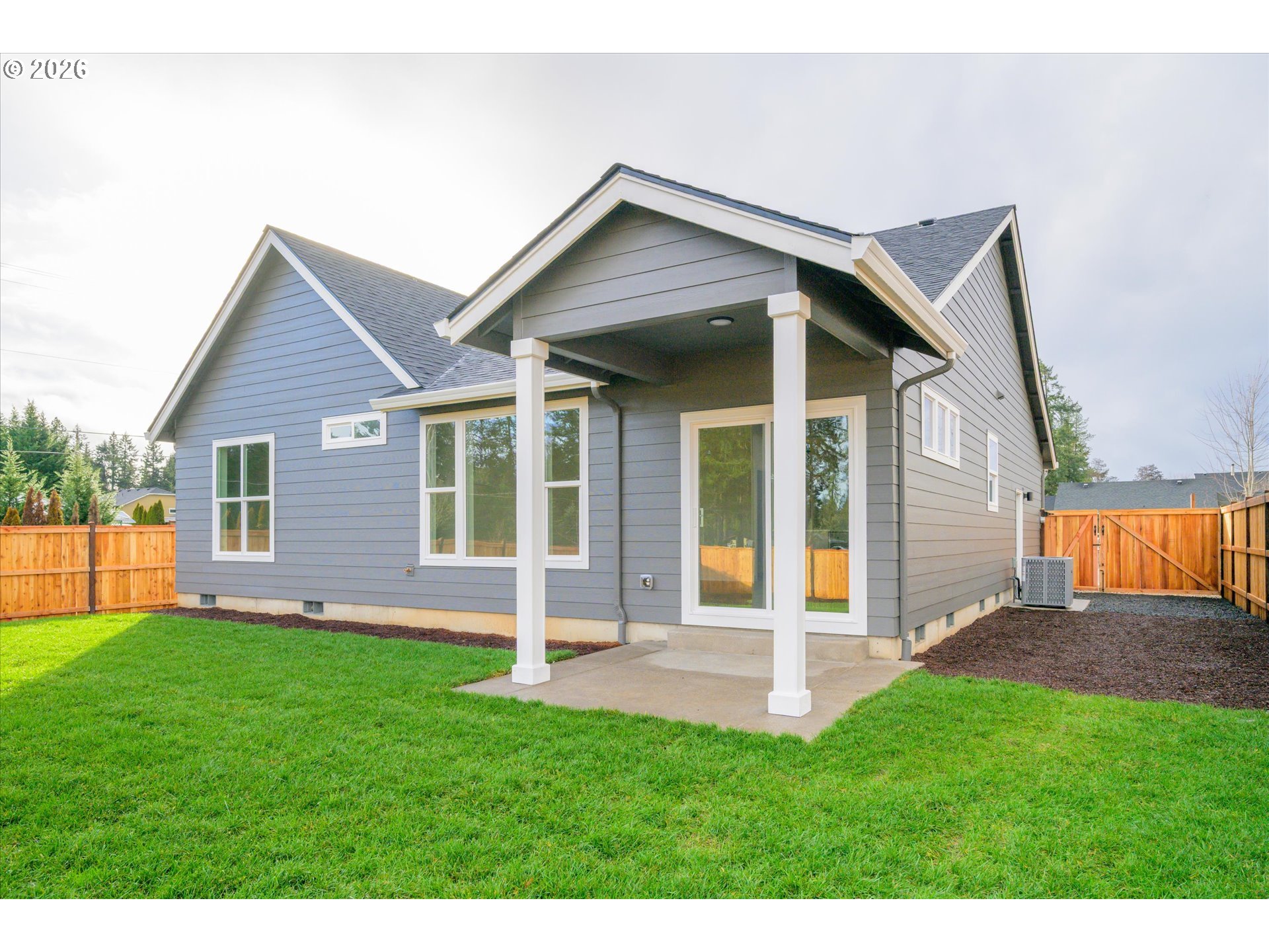88091 Jameson Way Veneta, OR 97487 - Photo 21 of 22 a front view of a house with a yard and porch