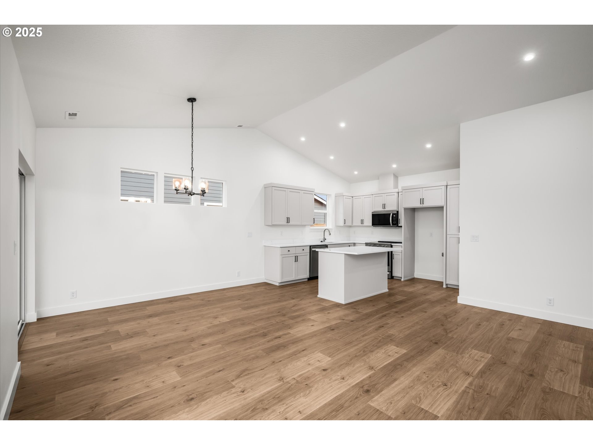 88091 Jameson Way Veneta, OR 97487 - Photo 4 of 22 a view of kitchen with kitchen island white cabinets and stainless steel appliances