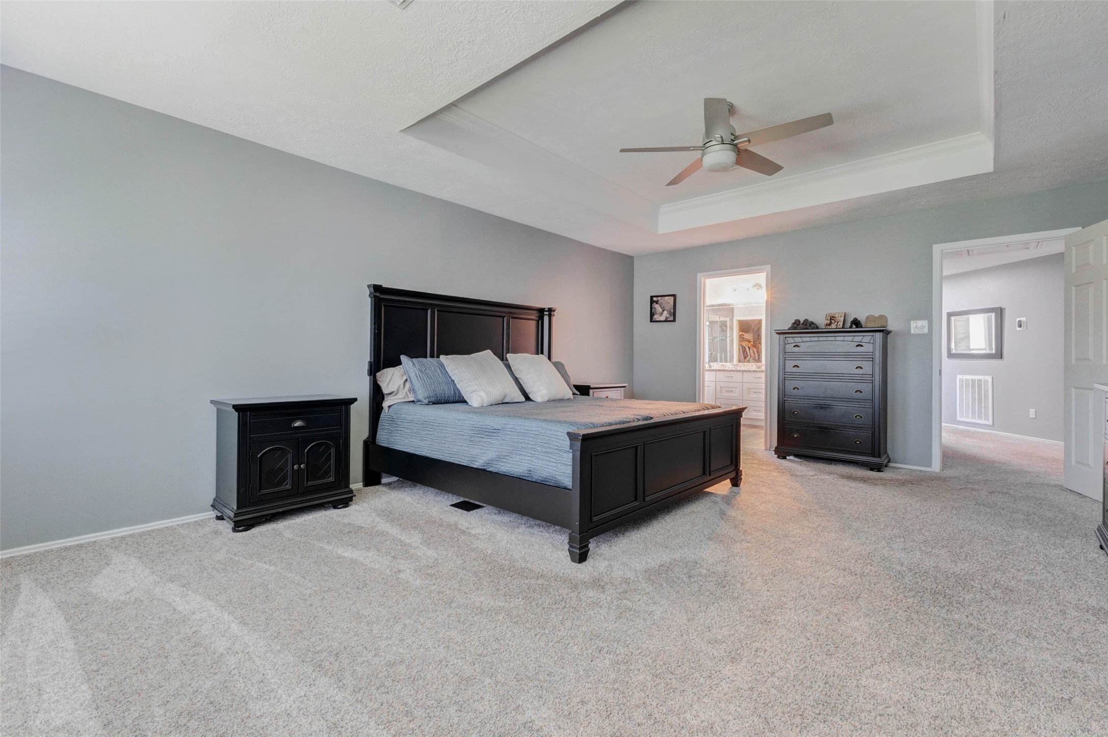 9215 Landry Boulevard Spring, TX 77379 - Photo 26 of 42 Decorator paint, plush carpet, and the oversized layout provide ample space for a king size bedroom set with plenty of room remaining for a sitting area, additional furniture, or a private retreat feel.