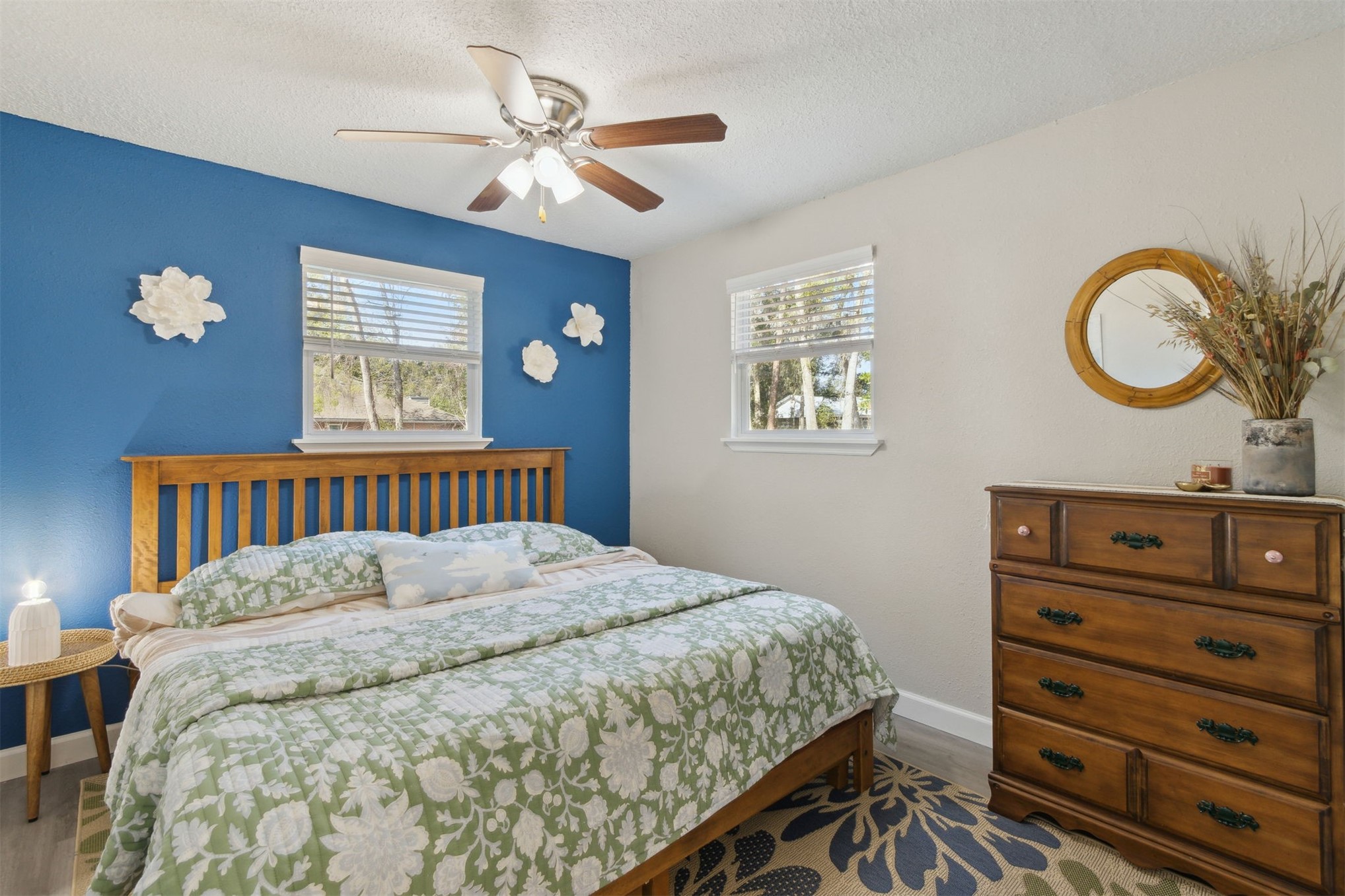 97471 Cutlass Way Yulee, FL 32097 - Photo 14 of 56 a bedroom with a bed and a chandelier