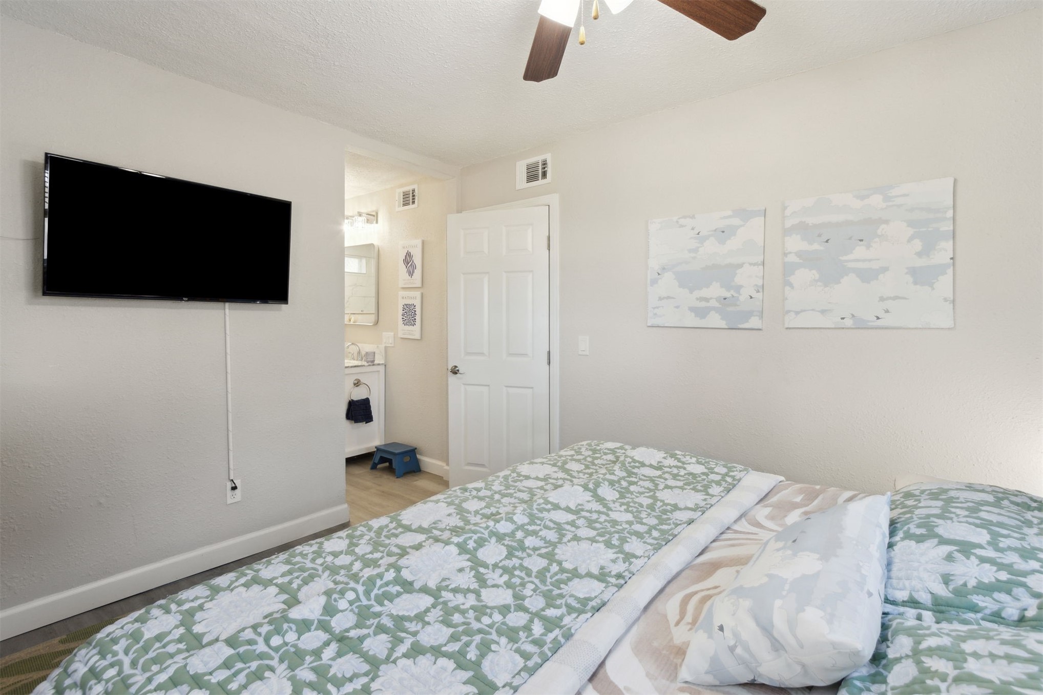 97471 Cutlass Way Yulee, FL 32097 - Photo 15 of 56 a bedroom with a bed and a flat screen tv