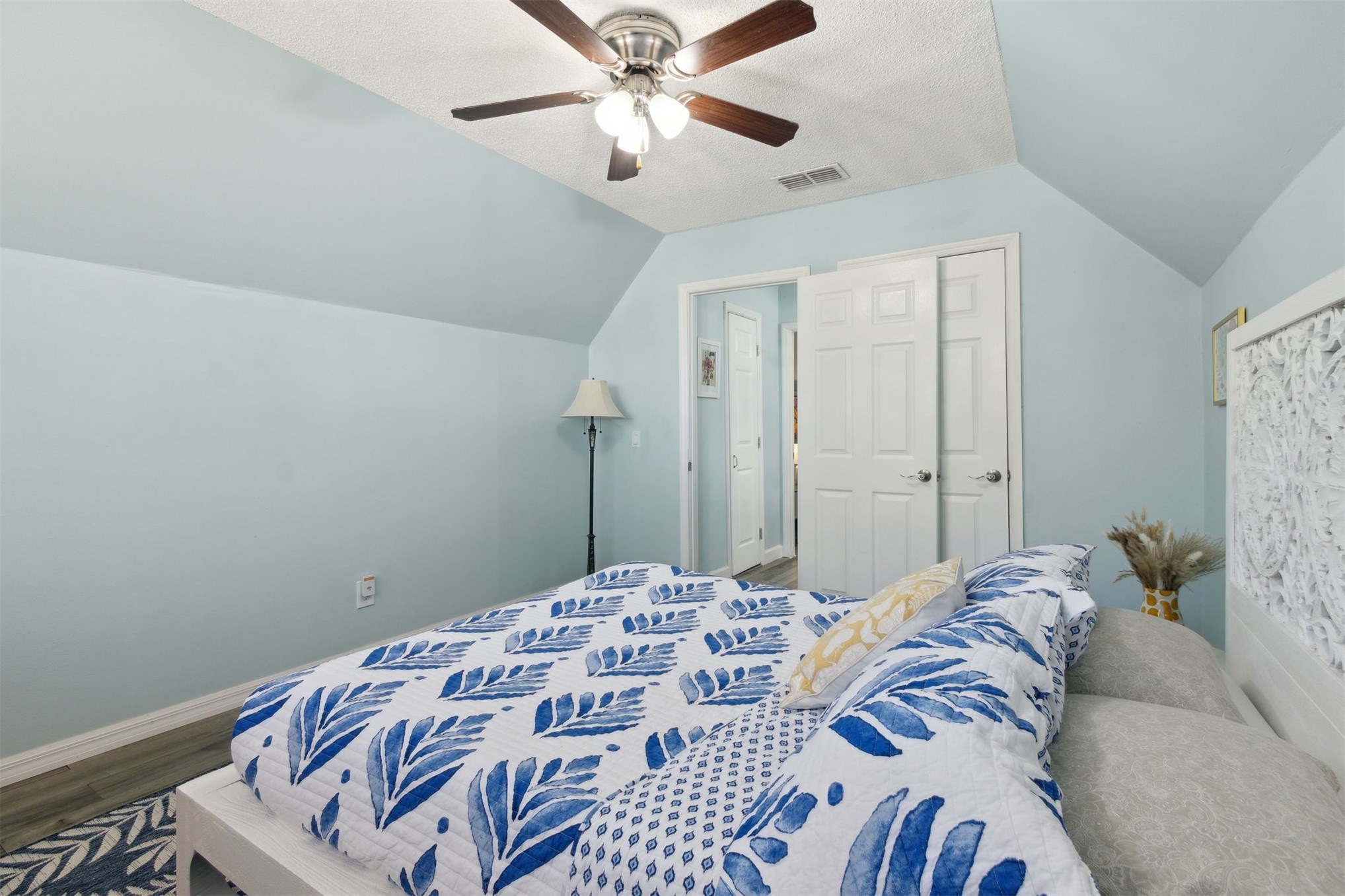 97471 Cutlass Way Yulee, FL 32097 - Photo 29 of 56 a bedroom with a bed and a chandelier