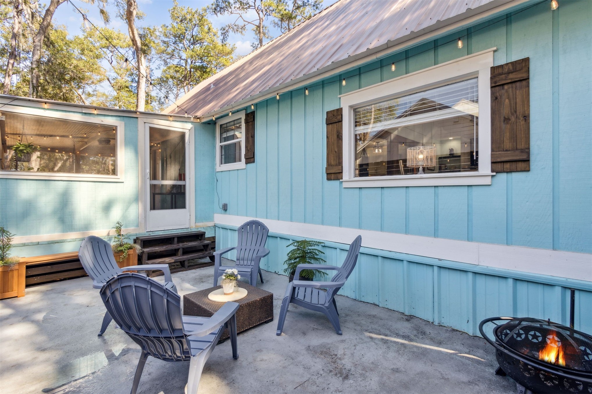 97471 Cutlass Way Yulee, FL 32097 - Photo 31 of 56 a outdoor living space with patio furniture and potted plants
