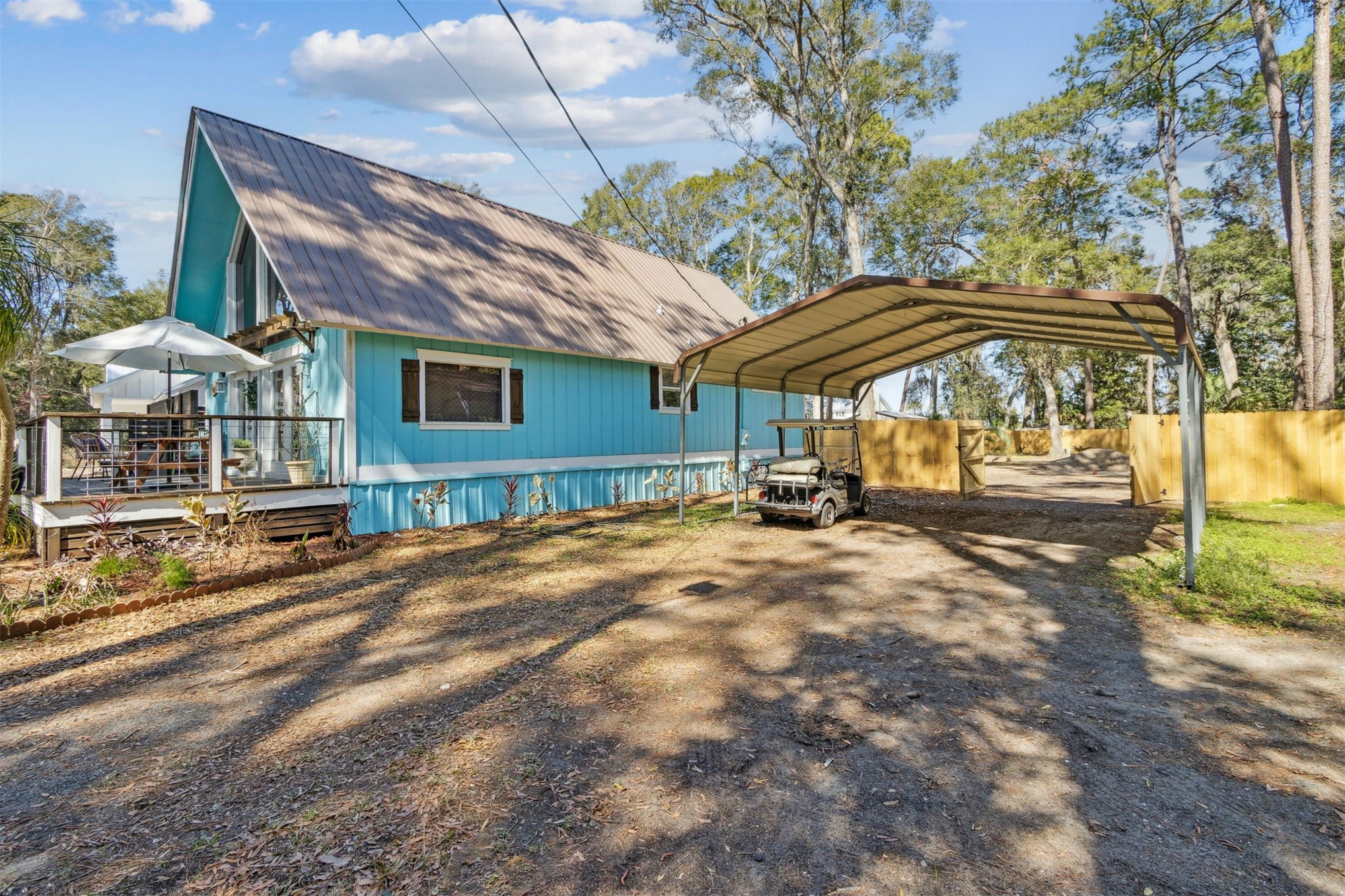 97471 Cutlass Way Yulee, FL 32097 - Photo 36 of 56 a backyard of a house with basket ball table and chairs
