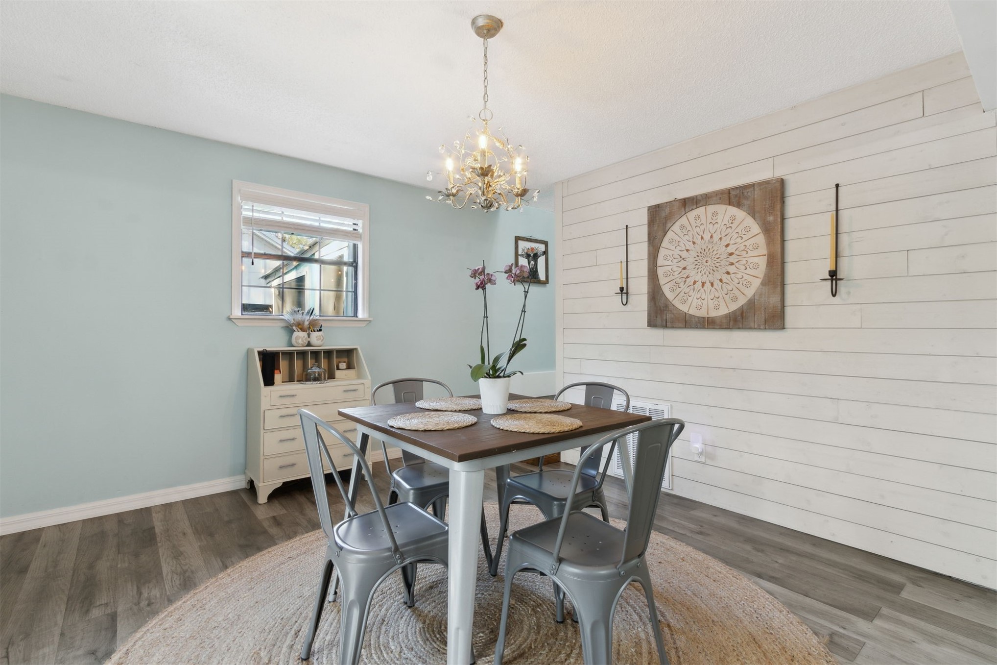 97471 Cutlass Way Yulee, FL 32097 - Photo 7 of 56 a view of a dining room with furniture and a chandelier