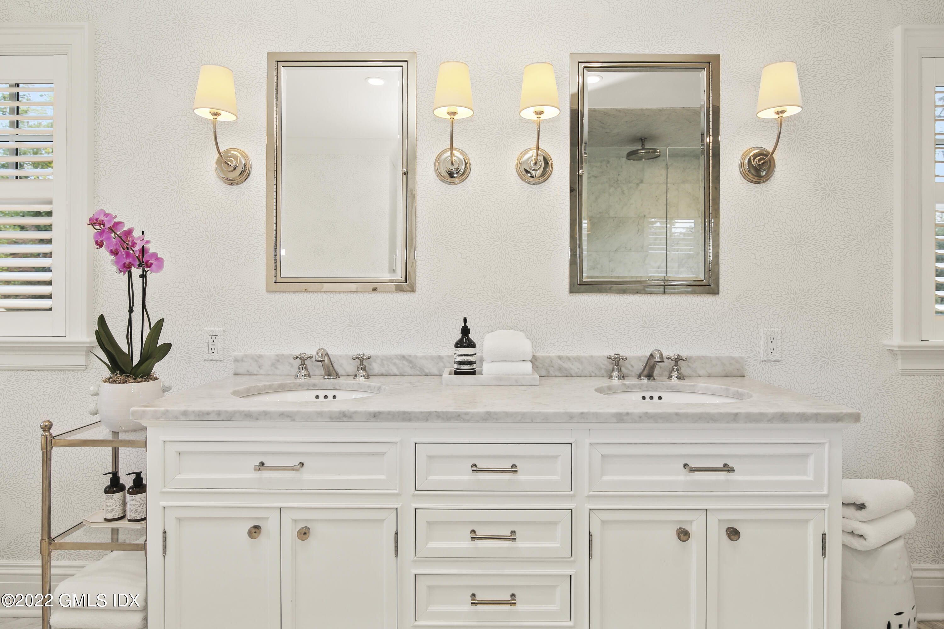 249 Riverside Avenue Riverside, CT 06878 - Photo 37 of 56 a bathroom with a sink vanity and a mirror