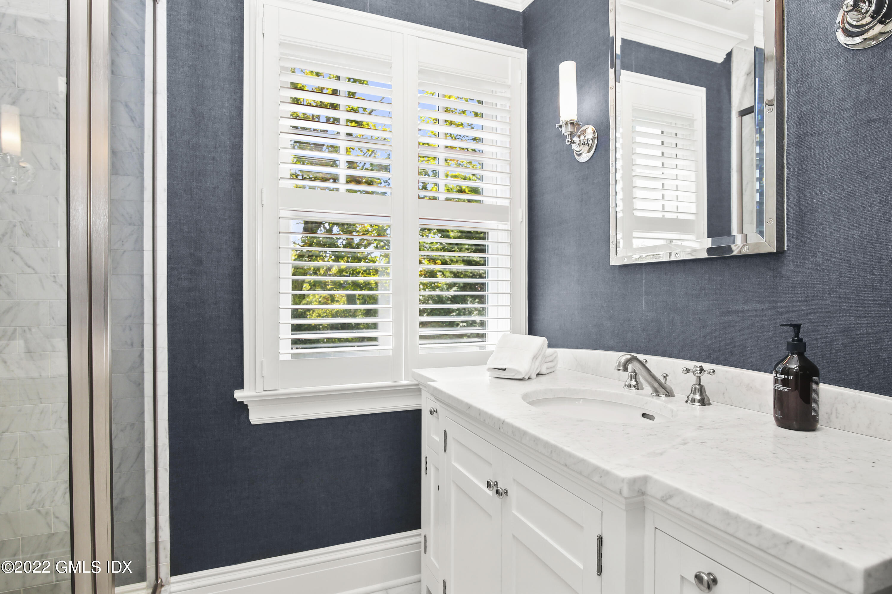 249 Riverside Avenue Riverside, CT 06878 - Photo 39 of 56 a bathroom with a sink a vanity and a window