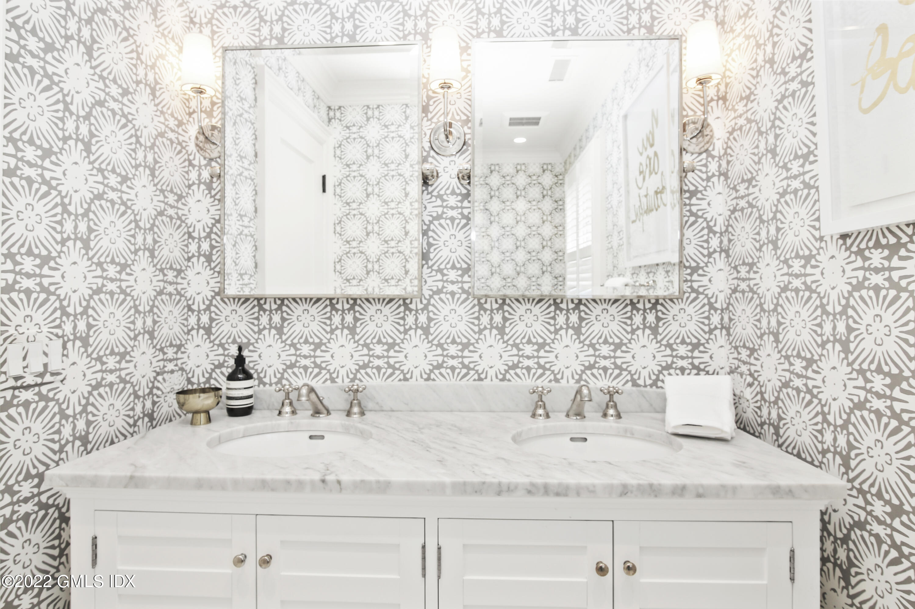 249 Riverside Avenue Riverside, CT 06878 - Photo 41 of 56 a bathroom with a sink and a mirror