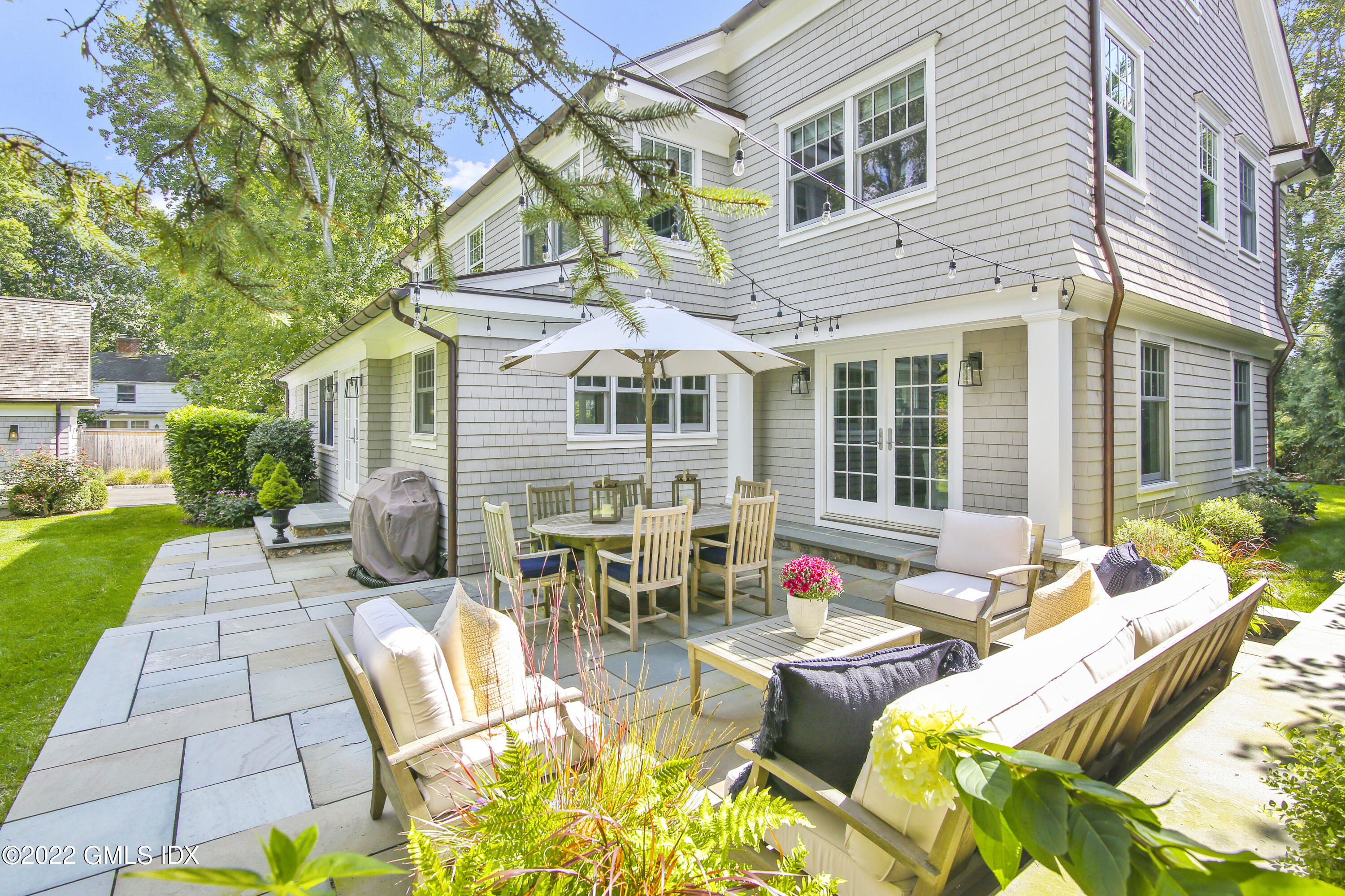 249 Riverside Avenue Riverside, CT 06878 - Photo 46 of 56 a view of a patio with couches table and chairs and potted plants