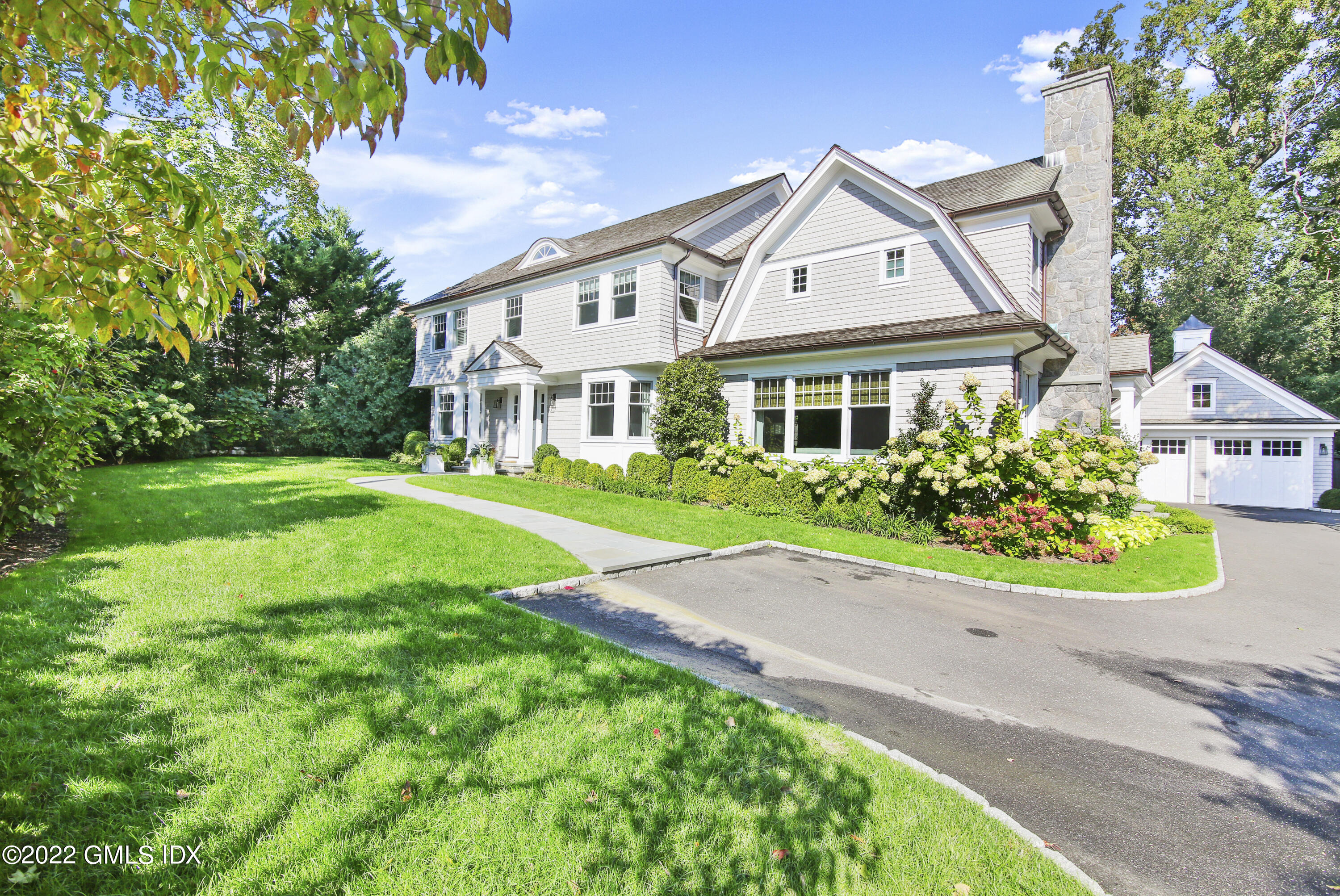 249 Riverside Avenue Riverside, CT 06878 - Photo 48 of 56 a front view of a house with garden