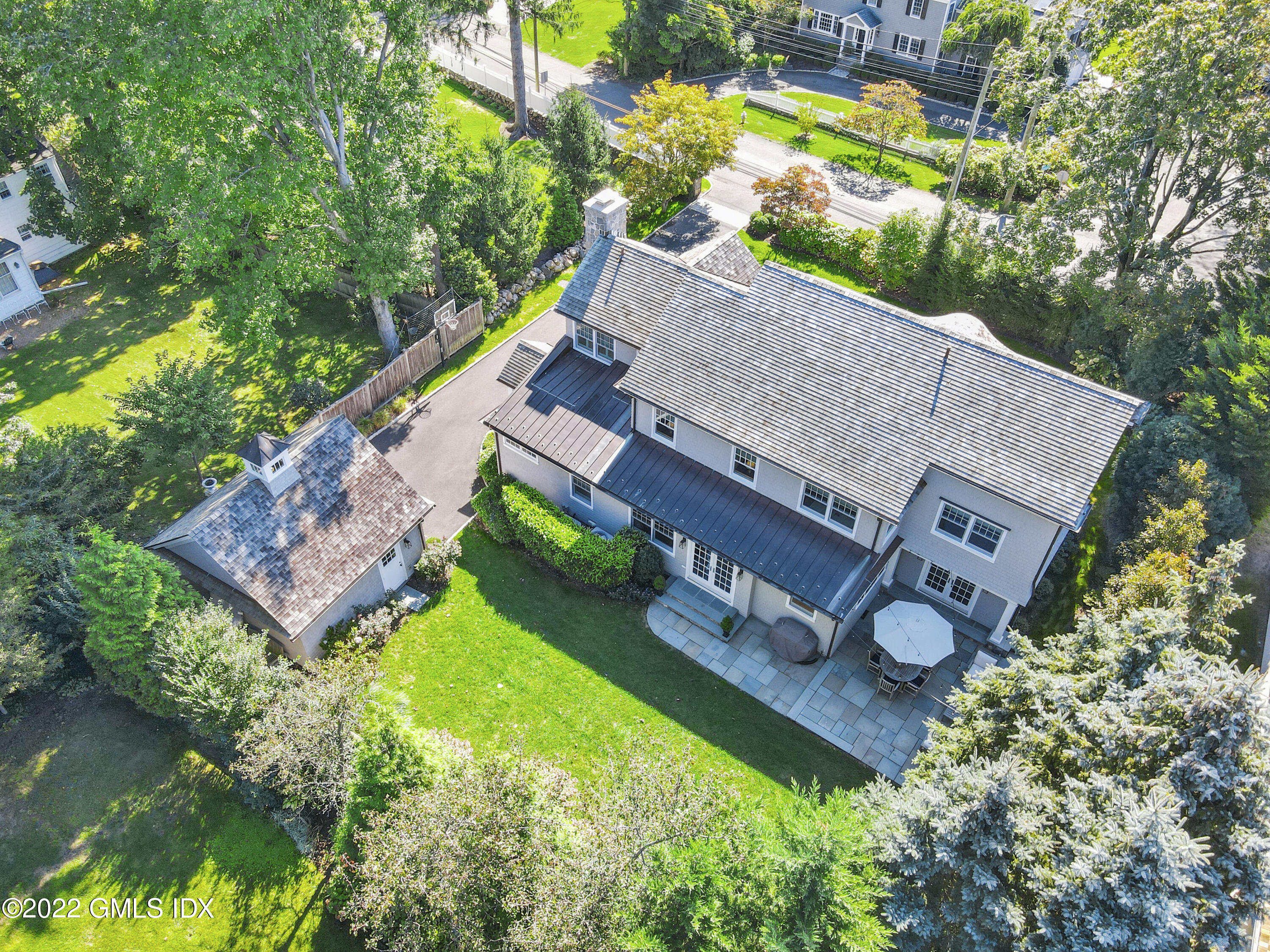 249 Riverside Avenue Riverside, CT 06878 - Photo 50 of 56 an aerial view of a house with garden space and a patio
