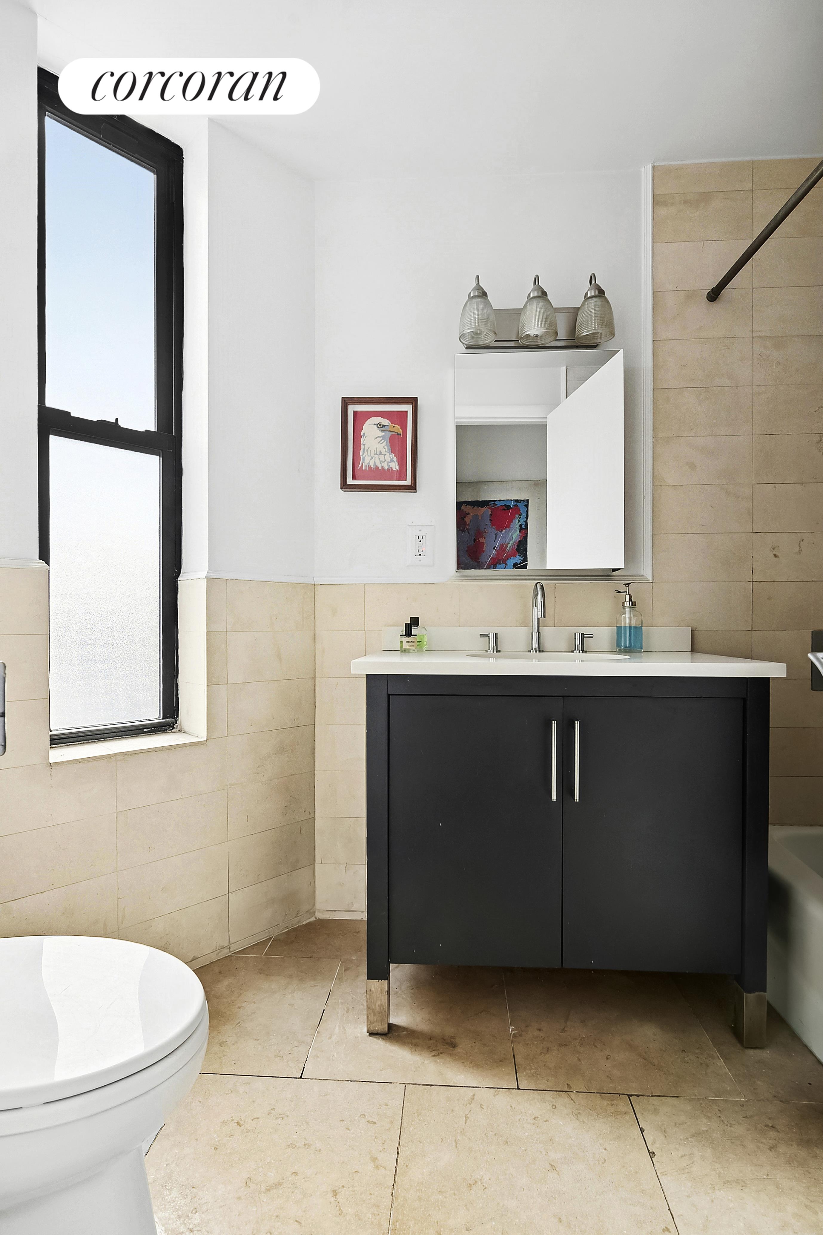 445 3rd Avenue, Unit 202 Brooklyn, NY 11215 - Photo 3 of 6 a bathroom with a sink a toilet and mirror