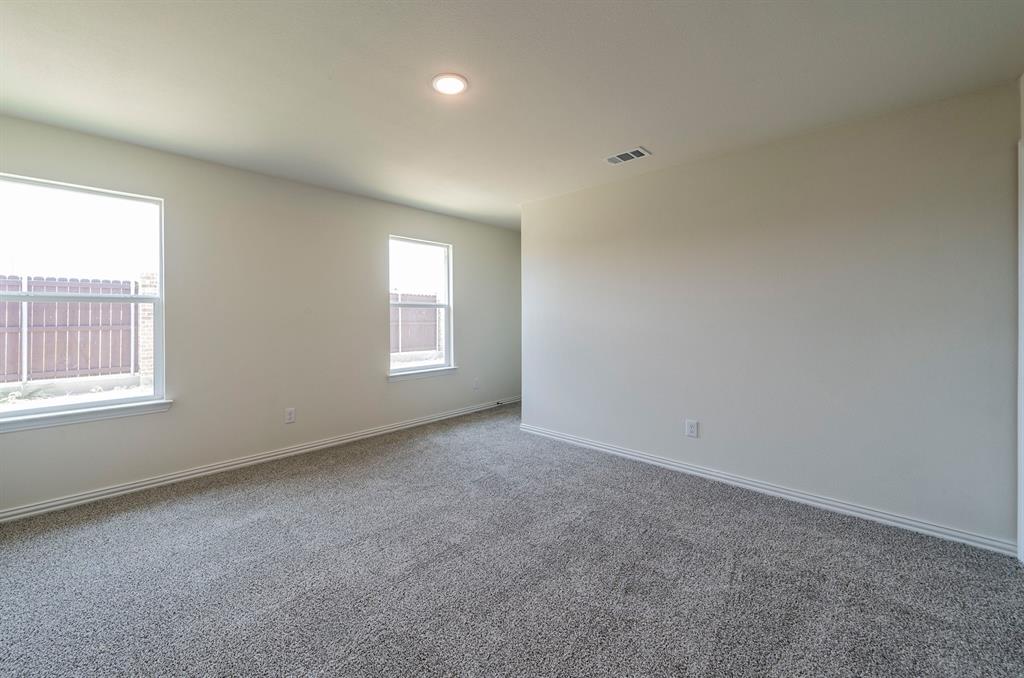 114 Goel Street Greenville, TX 75402 - Photo 11 of 32 an empty room with windows