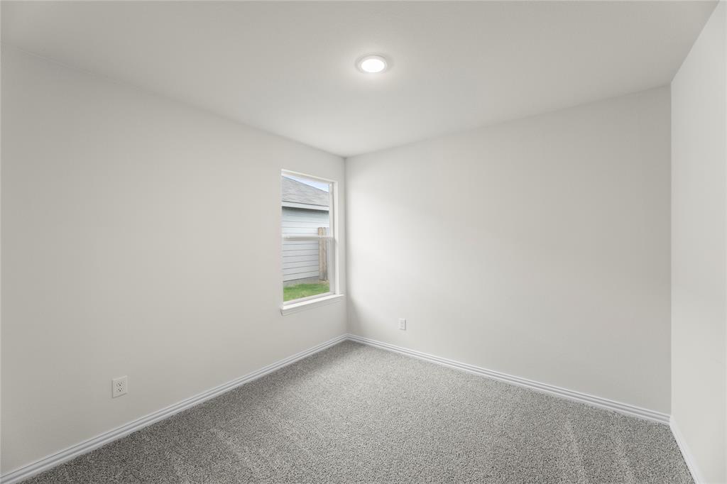 114 Goel Street Greenville, TX 75402 - Photo 12 of 32 an empty room with a window