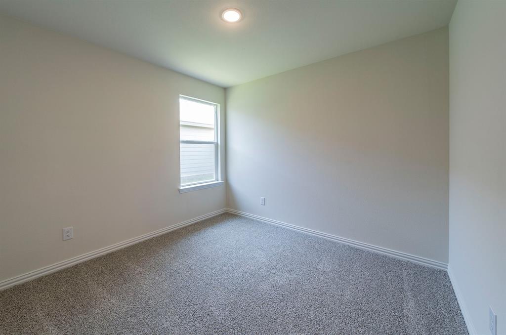 114 Goel Street Greenville, TX 75402 - Photo 19 of 32 an empty room with windows