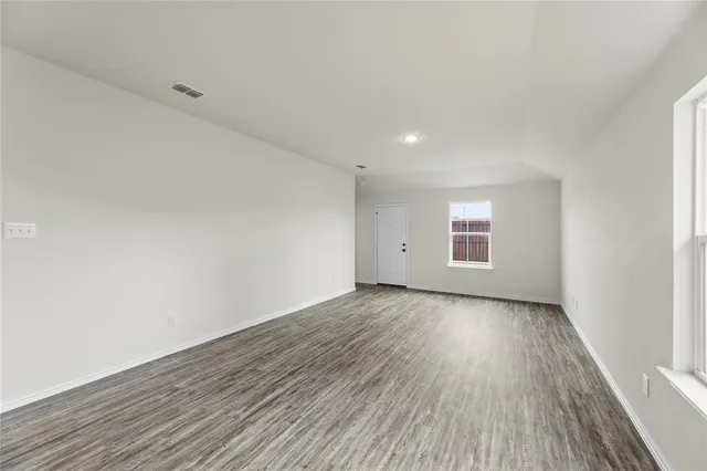 a view of a kitchen with a sink and a refrigerator