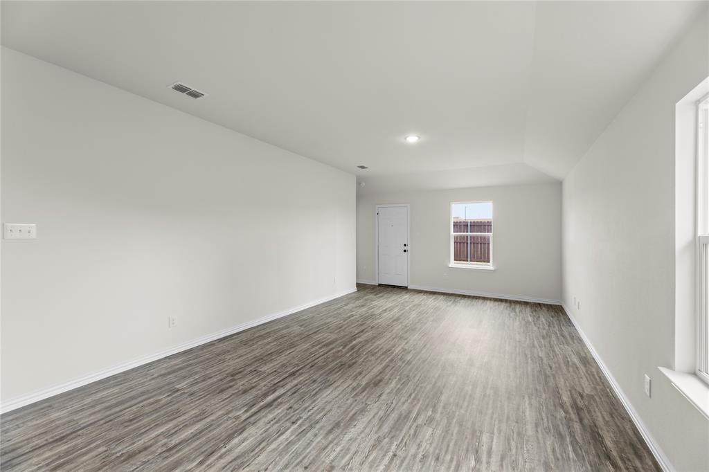 114 Goel Street Greenville, TX 75402 - Photo 25 of 32 a view of a room with wooden floor and window