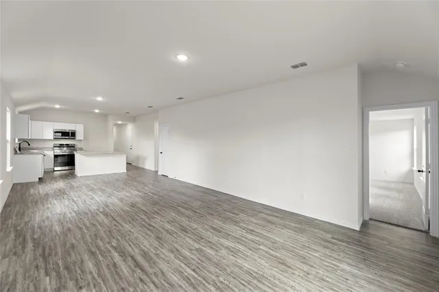 a view of an empty room with a window