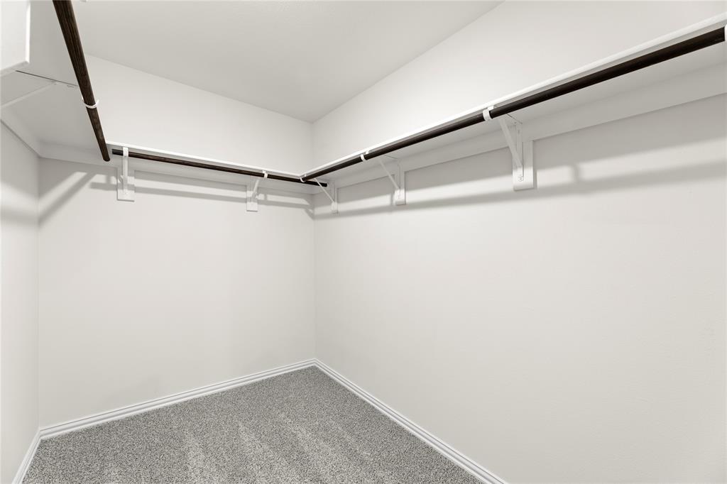 114 Goel Street Greenville, TX 75402 - Photo 31 of 32 a view of a room with racks on the wall