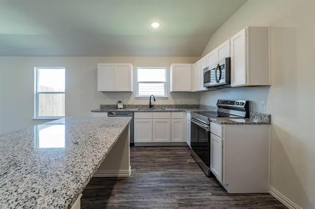 a bathroom with a sink toilet and a bathtub