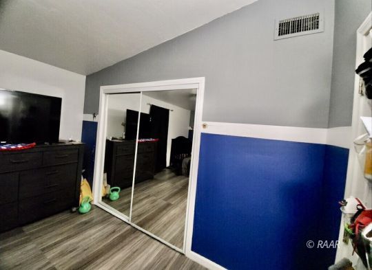 425 North Norma Street Ridgecrest, CA 93555 - Photo 33 of 33 a living room with furniture and a flat screen tv