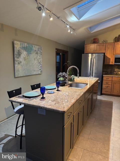 2118 Welsh Valley Road Phoenixville, PA 19460 - Photo 12 of 37 a kitchen with stainless steel appliances granite countertop a sink a stove and a refrigerator