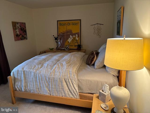 2118 Welsh Valley Road Phoenixville, PA 19460 - Photo 24 of 37 a bedroom with a bed and lamp