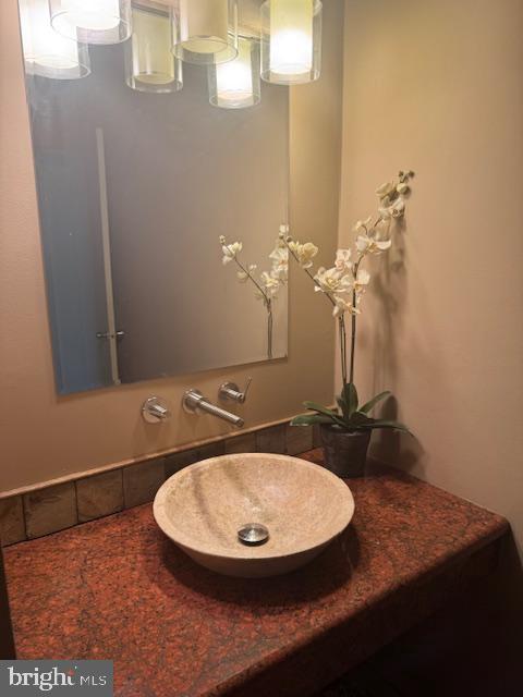 2118 Welsh Valley Road Phoenixville, PA 19460 - Photo 25 of 37 a bathroom with a sink and a mirror