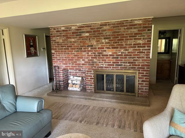 2118 Welsh Valley Road Phoenixville, PA 19460 - Photo 28 of 37 a living room with furniture and a fireplace